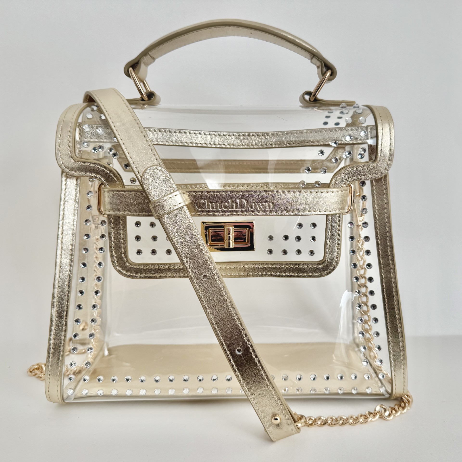 ClutchDown Gold Standard clear stadium bag with gold leather and crystals